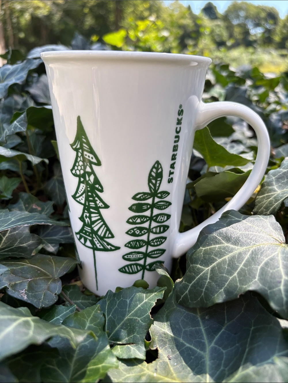 Starbucks White Mug with Green Tree and Leaf Motifs 2015